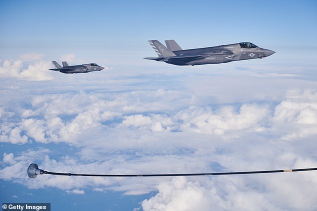 Two F-35B combat aircraft from the United States Marine Corp prepare to re-fuel from an RAF Voyager aircraft over the North Sea in flight above Scotland today