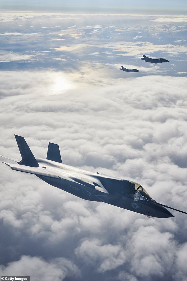 An F-35B combat aircraft from the United States Marine Corp refuels from an RAF Voyager aircraft over the North Sea in flight above Scotland today
