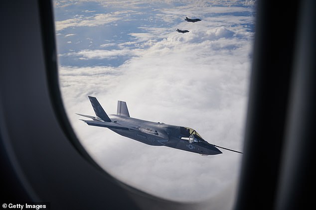 An F-35B combat aircraft from the United States Marine Corp refuels from an RAF Voyager aircraft over the North Sea in flight above Scotland today